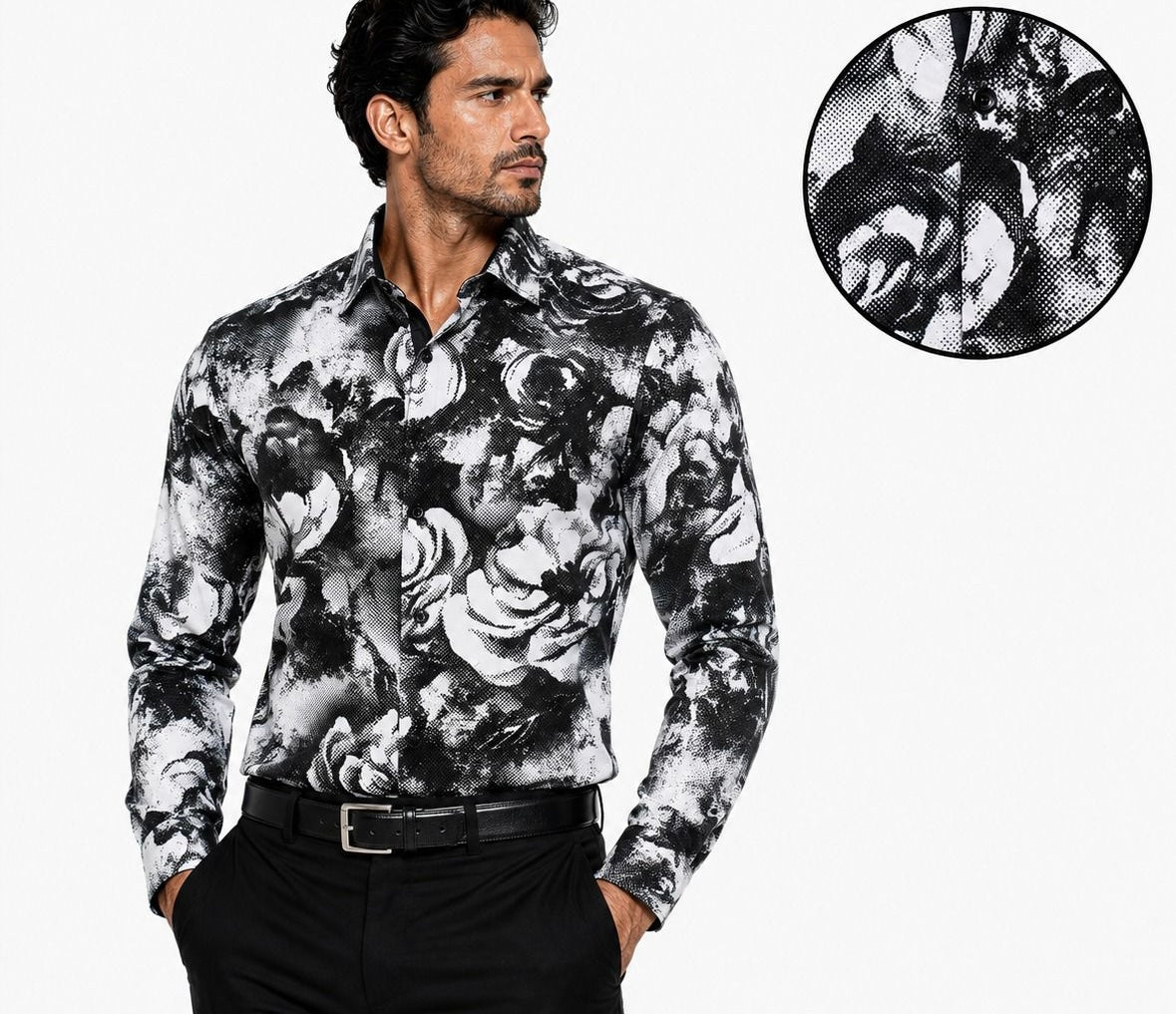 A man wearing a long-sleeve button-up shirt with a black and white floral print, paired with black trousers and a black belt. A circular inset in the top right shows a close-up of the fabric's detailed floral pattern.